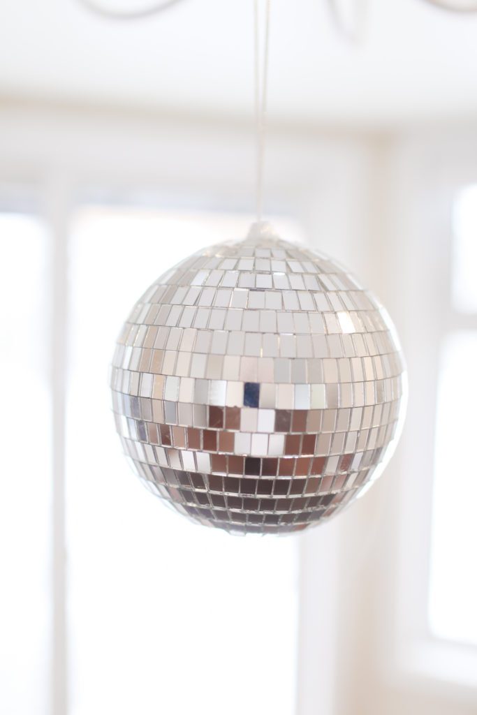 A close up of a hanging disco ball