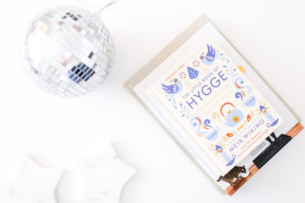 Disco ball and book about Hygge