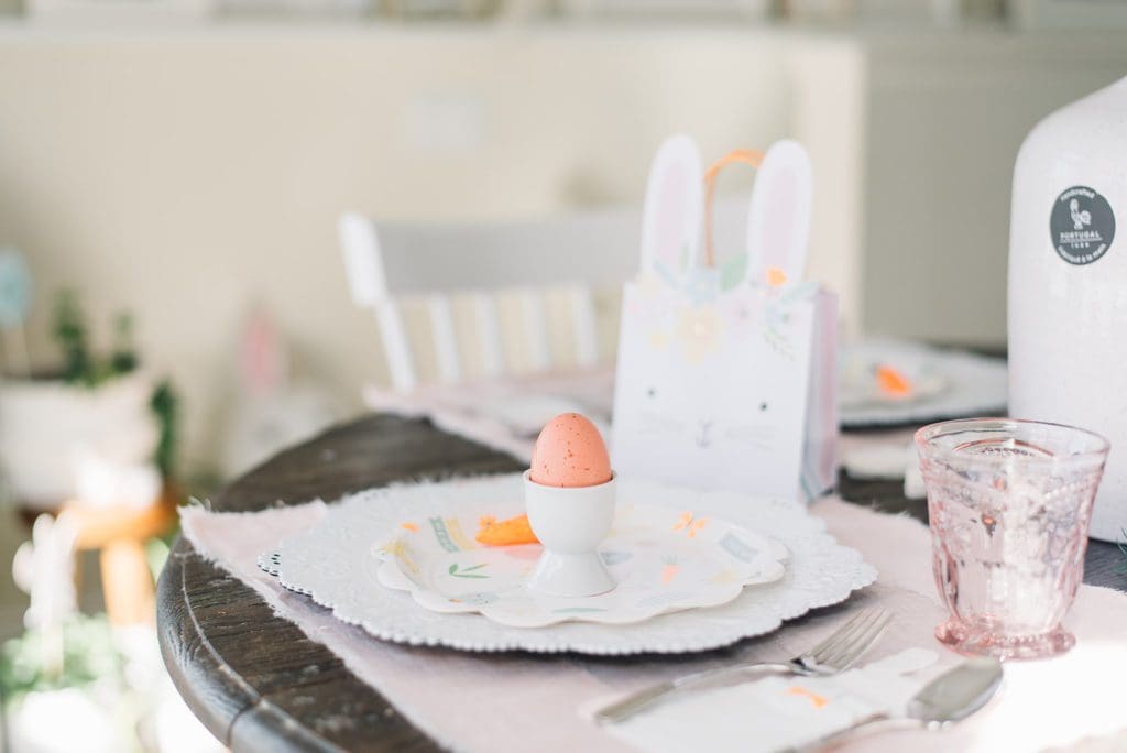 An easter place setting with a bunny gift bag